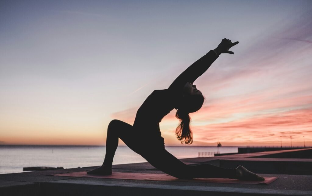 Group of people doing yoga in a park on International Yoga Day